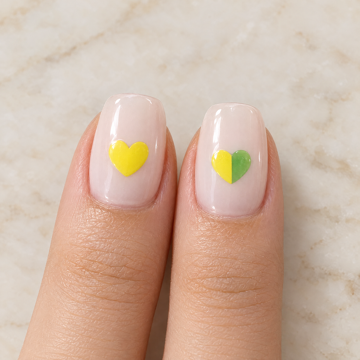 Unchanged yellow heart sticker next to a heart sticker half turned green