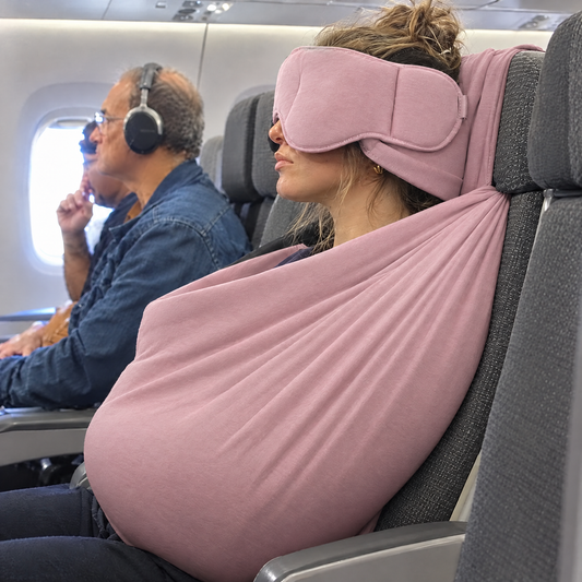 Pink travel sleep set on a plane